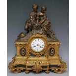 A LARGE 19TH CENTURY FRENCH GILT MANTEL CLOCK, with figurative surmount, the enamel dial signed F