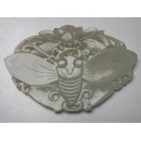 A CHINESE CELADON JADE CARVED AND PIERCED INSECT / MOTH PLAQUE, finely carved in shallow relief with