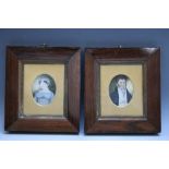 A PAIR OF 19TH CENTURY OVAL PORTRAITS OF A HUSBAND AND WIFE, in fruitwood frames, unsigned, framed