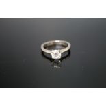 AN 18 CARAT WHITE GOLD DIAMOND SOLITAIRE RING, the solitaire being approx 0.75 carat, ring size N