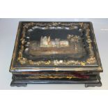 A VICTORIAN PAPIER MACHE WRITING SLOPE, with gilt painted detail and mother-of- pearl inlay, W 28 cm