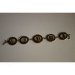 A LATE 19TH / EARLY 20TH CENTURY MICRO MOSAIC PANEL LINK BRACELET, each oval panel depicting