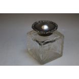 A HALLMARKED SILVER LIDDED CUT GLASS INKWELL - LONDON 1900, makers mark for William Commyns, 5.5