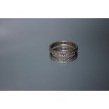 AN 18KT WHITE GOLD DIAMOND SET BAND, having nine small brilliant cut diamonds, approx weight 5.2g,