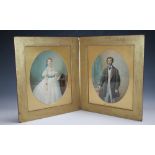 A PAIR OF CASED LATE 19TH / EARLY 20TH CENTURY OVAL PORTRAIT STUDIES OF A LADY AND GENTLEMAN IN AN