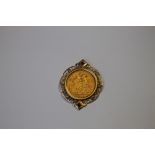 AN EDWARD VII FULL SOVEREIGN, in yellow metal mount set with rubies and diamonds, approx weight 11.