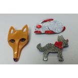 THREE LEA STEIN OF PARIS BROOCHES, modelled in the form of a fox head, H 7 cm, a terrier dog, W 5.