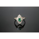 AN 18 CARAT WHITE GOLD EMERALD AND DIAMOND RING, set with central emerald cut emerald, ring size T