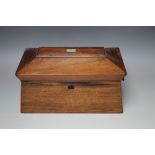 A 19TH CENTURY ROSEWOOD SARCOPHAGUS SHAPED TEA CADDY, the hinged lid opening to a part fitted