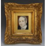 A LATE 19TH / EARLY 20TH CENTURY PORTRAIT MINIATURE OF A GENTLEMAN WITH WHITE CRAVAT, in a gilt