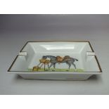 A HERMES RECTANGULAR PORCELAIN ASHTRAY, the hand painted detail depicting a dappled horse, signed '