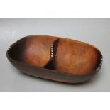 A TRIBAL WARE OVAL TWO SECTION BOWL, with inlaid detail to the edges, W 20 cm