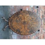 A VICTORIAN WALNUT OVAL LOO TABLE, quarter cut veneer top, with original tilt-top mechanism,