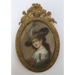 A NINETEENTH CENTURY OVAL PORTRAIT MINIATURE OF A LADY IN A PLUMED HAT, in an oval decorative gilt