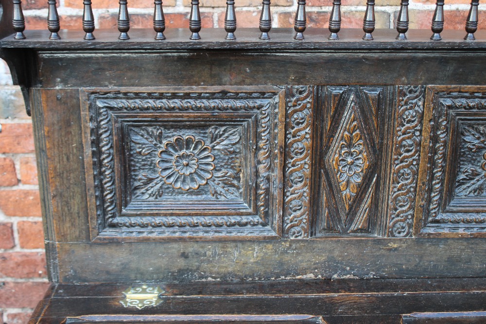 A 19TH CENTURY AND LATER CARVED OAK CUPBOARD, the lower coffer section with half hinged lid, - Image 6 of 6