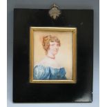 A LATE 19TH / EARLY 20TH CENTURY PORTRAIT MINIATURE OF A LADY IN A BLUE DRESS AND A RED NECKLACE, in