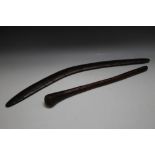 AN ABORIGINAL BOOMERANG TOGETHER WITH A HARDWOOD ROOT THROWING CLUB, the boomerang measuring