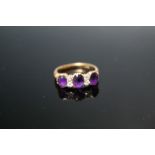 AN ORNATE 18 CT THREE STONE AMETHYST AND DIAMOND RING, approx weight 3.6g, ring size N