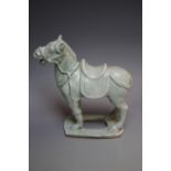 A CHINESE STYLE CELADON FIGURE OF A TANG HORSE, H 19 cm