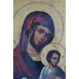 A LATE 17TH / EARLY 18TH CENTURY RELIGIOUS ICON OF THE MADONNA AND CHILD, signed and inscribed
