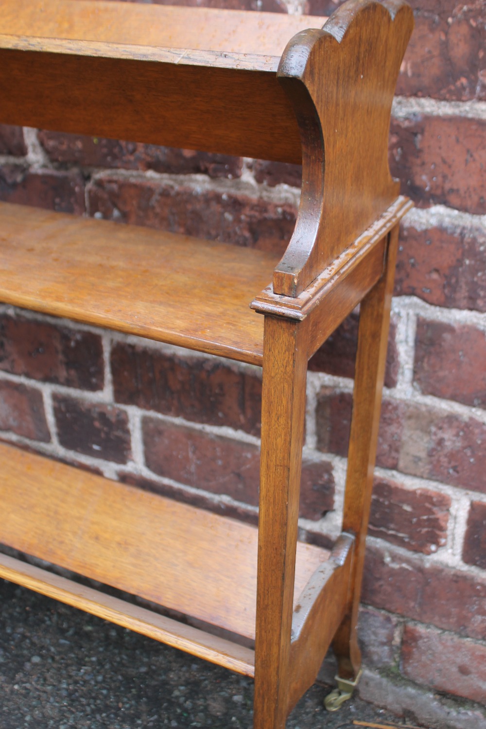 A 1920S OAK BOOK TROUGH, of three stages with shaped supports and original cappings and castors, H - Image 5 of 6