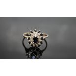 A HALLMARKED GOLD SAPPHIRE AND DIAMOND RING, ring size T