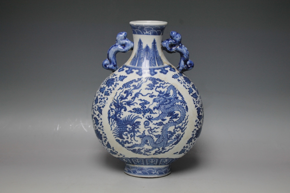 AN ORIENTAL TWIN HANDLED BLUE AND WHITE MOON VASE, having typical dragon decoration and six - Image 2 of 4