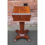 A 19TH CENTURY MAHOGANY TEAPOY, the lifting lid opening on a central support, raised on a tapered