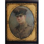 AN EARLY 20TH CENTURY OVAL PORTRAIT MINIATURE OF A WW1 ARMY OFFICER, in an oval decorative gilt