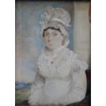 A LATE 19TH CENTURY PORTRAIT MINIATURE OF A LADY IN A WHITE DRESS AND BONNET, in a fruitwood