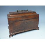 A VICTORIAN WALNUT TEA CADDY, of rectangular form, the hinged lid opening to reveal fitted