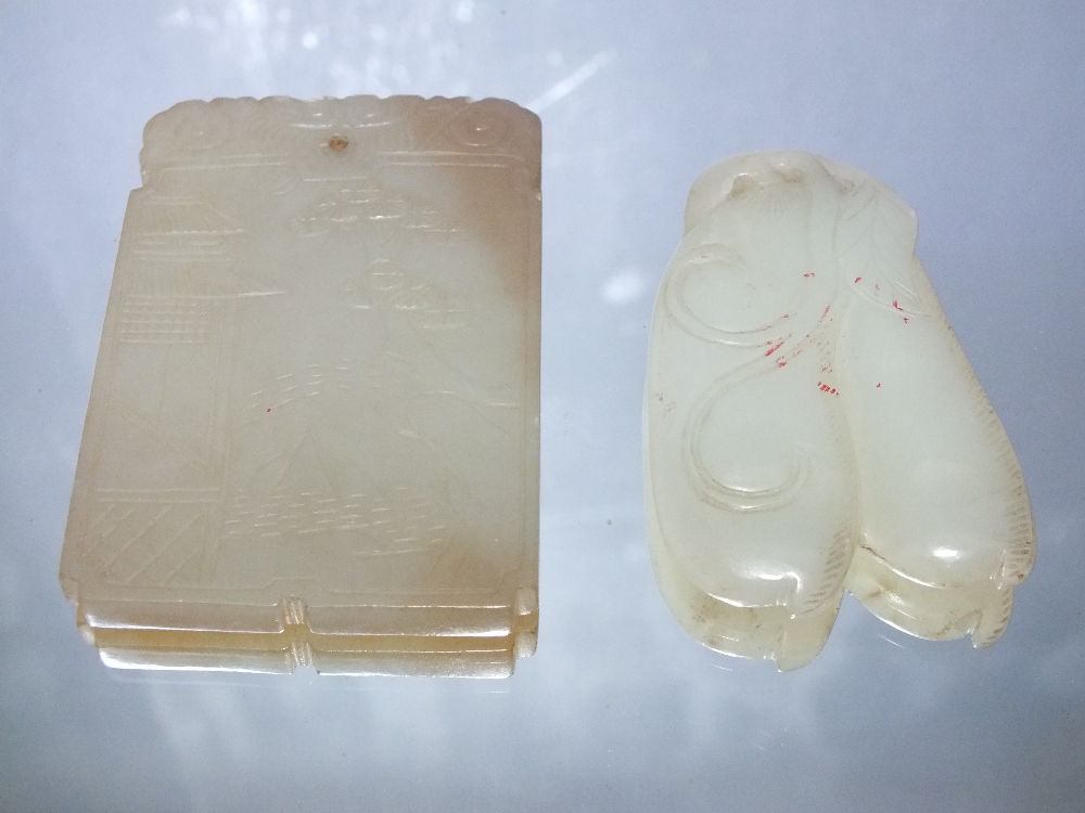 A CHINESE CELADON JADE PENDANT, finely carved in shallow relief to one side with a landscape - Image 2 of 3