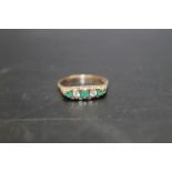 A HALLMARKED 9 CARAT GOLD EMERALD AND DIAMOND RING, ring size S