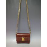 A VINTAGE SALVATORE FERRAGAMO ITALIAN TAN LEATHER SMALL CROSS BODY / CLUTCH BAG, with detachable