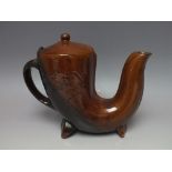 AN UNUSUAL EARTHENWARE WATER JUG, raised on two block feet, raised script to either side, W 25.5 cm,