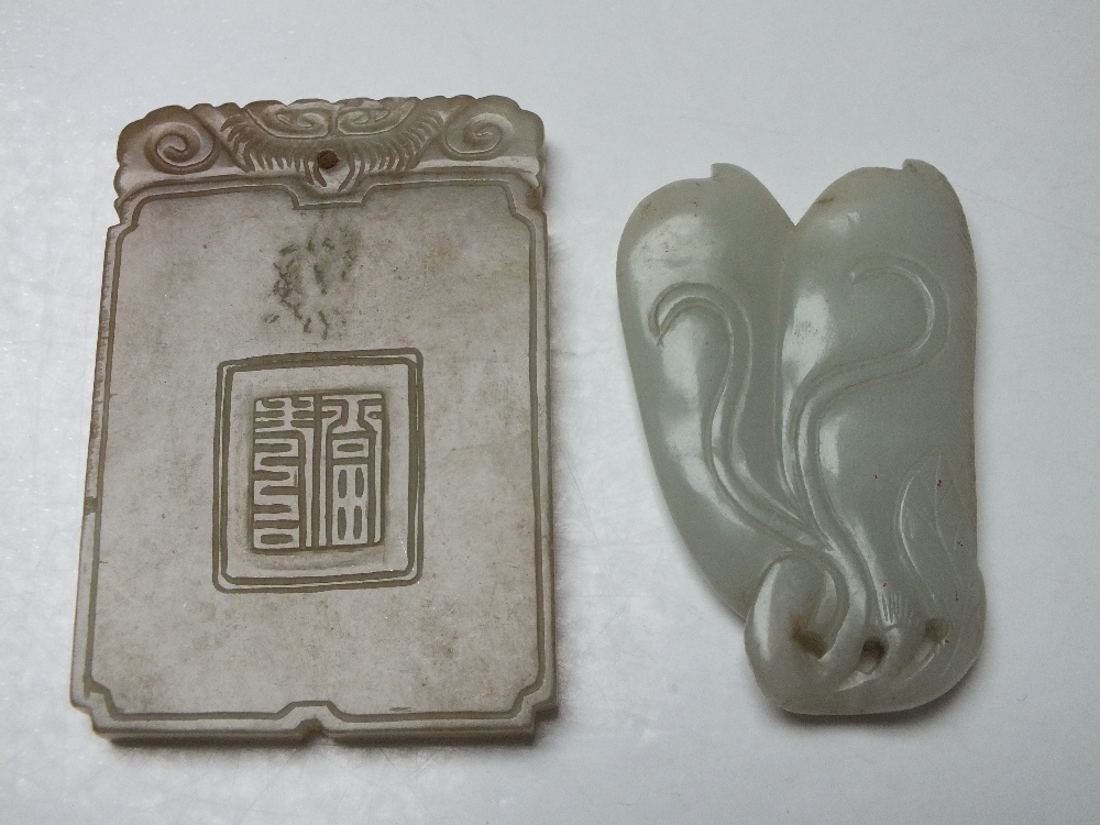 A CHINESE CELADON JADE PENDANT, finely carved in shallow relief to one side with a landscape - Image 3 of 3