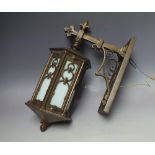 A MID 20TH CENTURY BRONZE WALL MOUNTED LANTERN AND BRACKET, the lantern of hexagonal form with