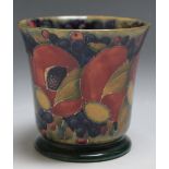 A MOORCROFT 'POMEGRANATE' PATTERN FOOTED VASE, impressed marks to base with painted signature and