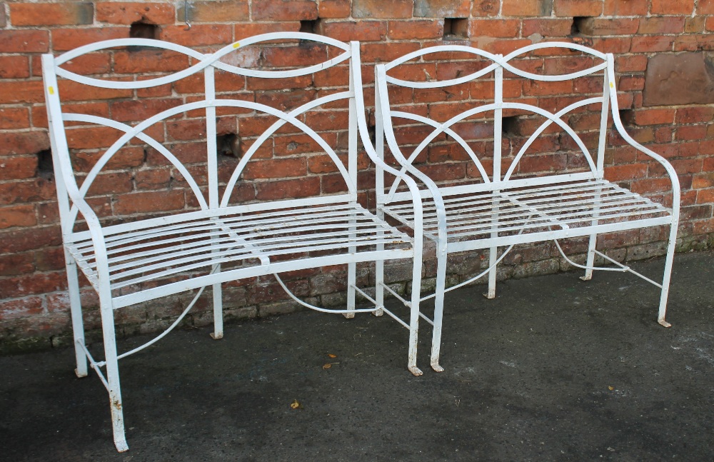 A PAIR OF CAST GARDEN BENCHES, with open scroll backs, W 106 cm