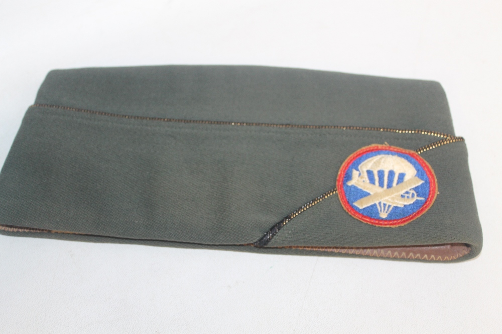 A VINTAGE US NAVY PEAK CAP with all weather cover, an associated jacket and an Airbourne (?) side c - Image 3 of 4