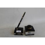 A MONT BLANC MEISTERSTUCK FOUNTAIN PEN in black along with associated Mont Blanc pen desk stand and