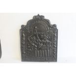 A REPRODUCTION ARCH TOPPED CAST IRON FIRE BACK, dated 1665 and inscribed "Hollandia Propatria" depi
