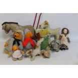 A COLLECTION OF VINTAGE SOFT TOYS, to include dogs, Wombles, etc and a push along donkey/mule on re