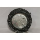 A HEAVY CAST METAL PORTHOLE, the external diameter 15" A/F