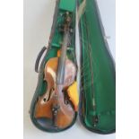 AN ANTIQUE TWO PIECE BACK VIOLIN, stamped to back 'Nach Hopf', decorated with a carved lions head t