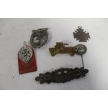 A COLLECTION OF GERMAN TYPE BADGES, to include a WWI honour cross with swords and a British Lancers