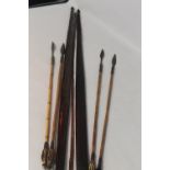 TWO VINTAGE PAPUA NEW GUINEA HUNTING BOWS, along with four arrows