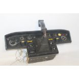 AN INSTRUMENT PANEL AND JOYSTICK, possibly from a flight simulator