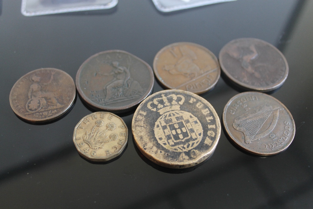 A SMALL GROUP OF COINS to include an Edward Bewley 1814 Wellington Victory Token and a 1946 three p