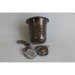 A SMALL 19TH CENTURY RUSSIAN NIELLO SILVER VODKA CUP, decorated with engraved scenes of buildings,
